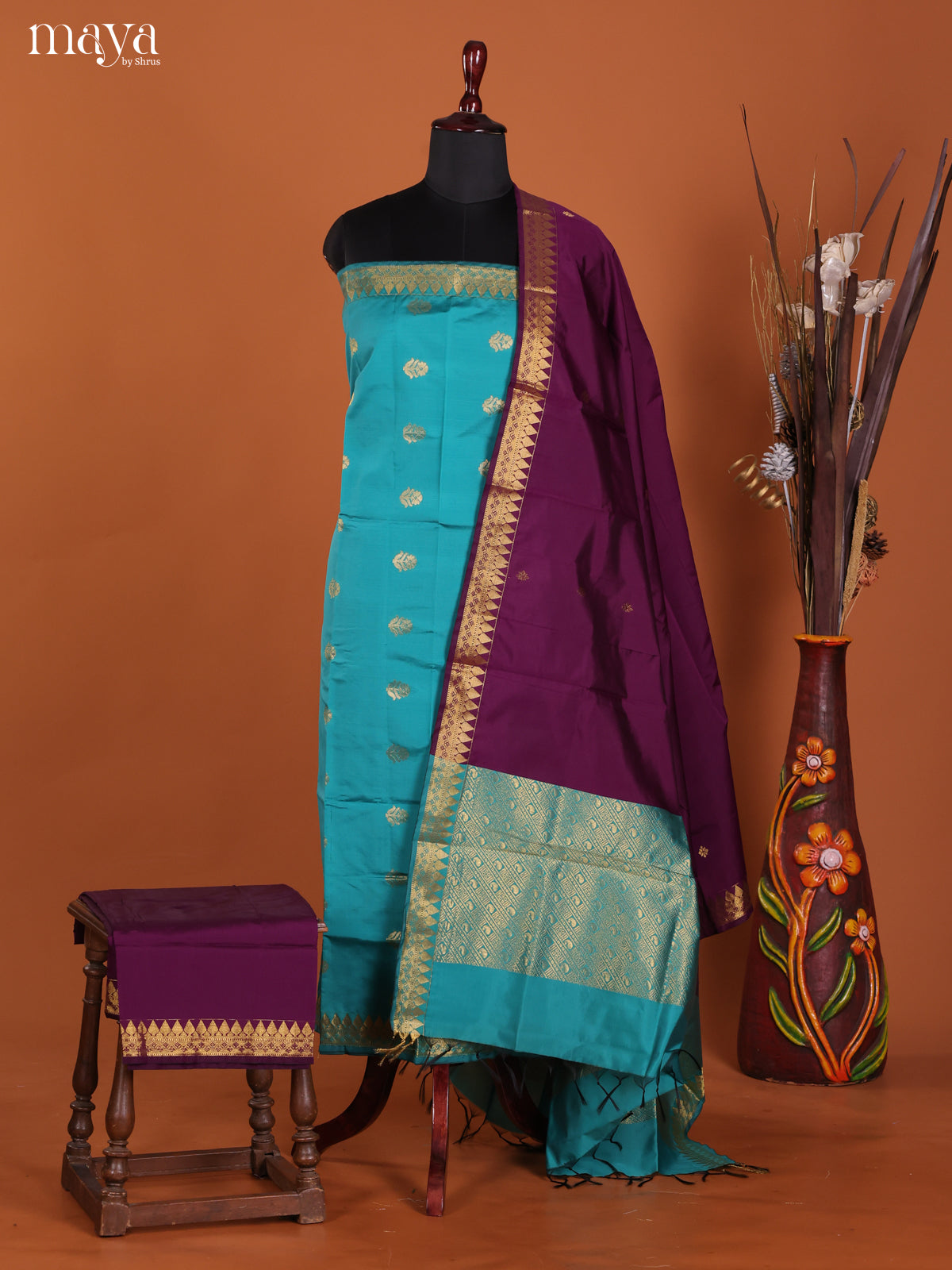 Radiant Turquoise Semi Silk Salwar Suit With Floral Buttis & Purple Dupatta