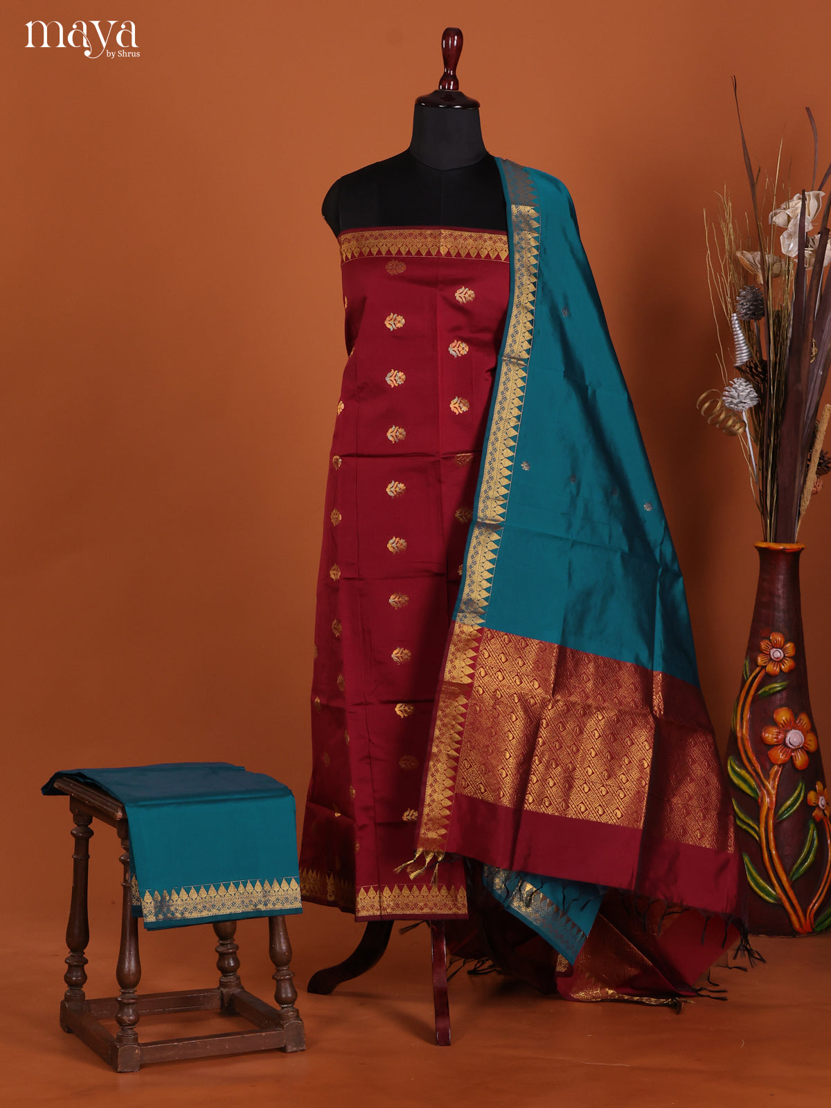 Striking Maroon Semi Silk Salwar Suit With Floral Buttas & Blue Dupatta