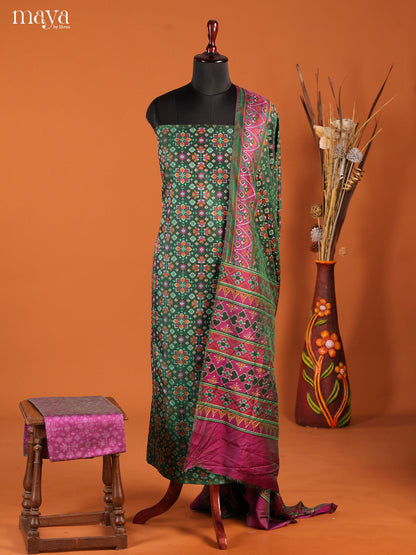 Artistic Green Semi Patola Salwar Suit Material With Floral Motifs
