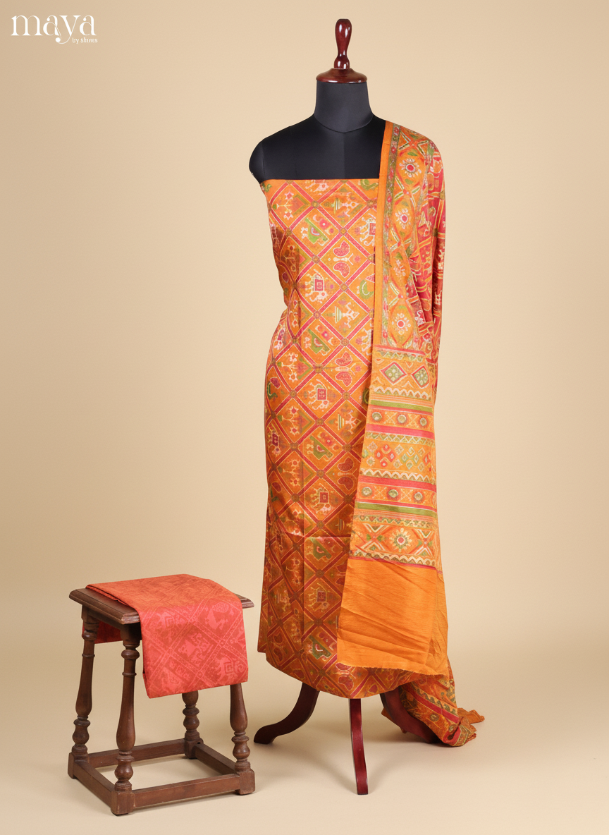 Lustrous Mustard Semi Patola Salwar Suit Material With Intricate Motifs