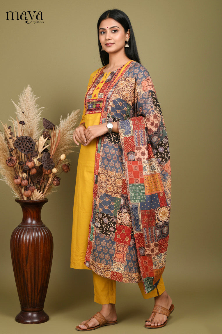 Elegant Yellow Cotton Salwar Set with Printed Yoke Neck & Patchwork Duppatta