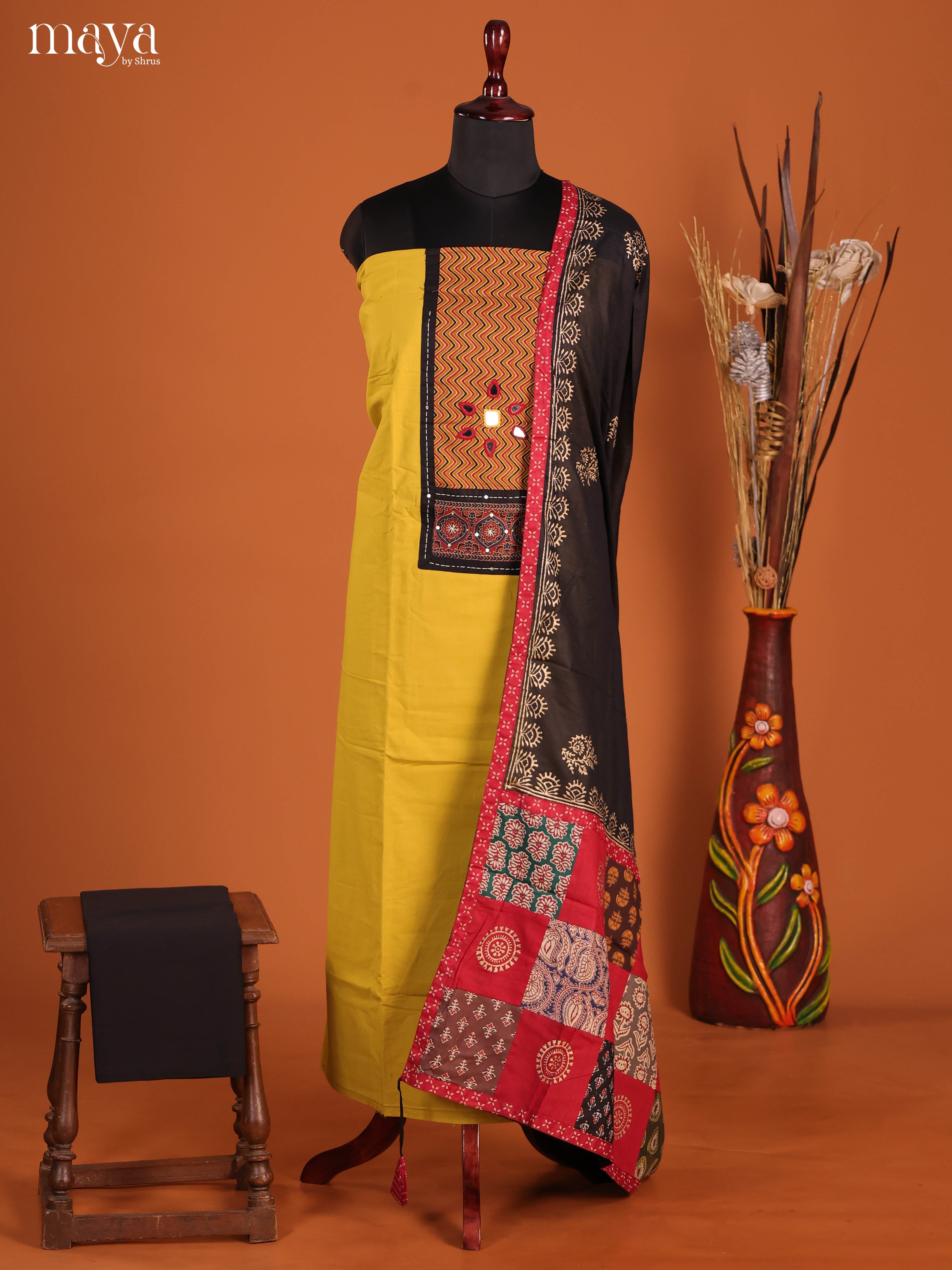 Vibrant Mustard Ajrakh Cotton Dress Material With Black Dupatta