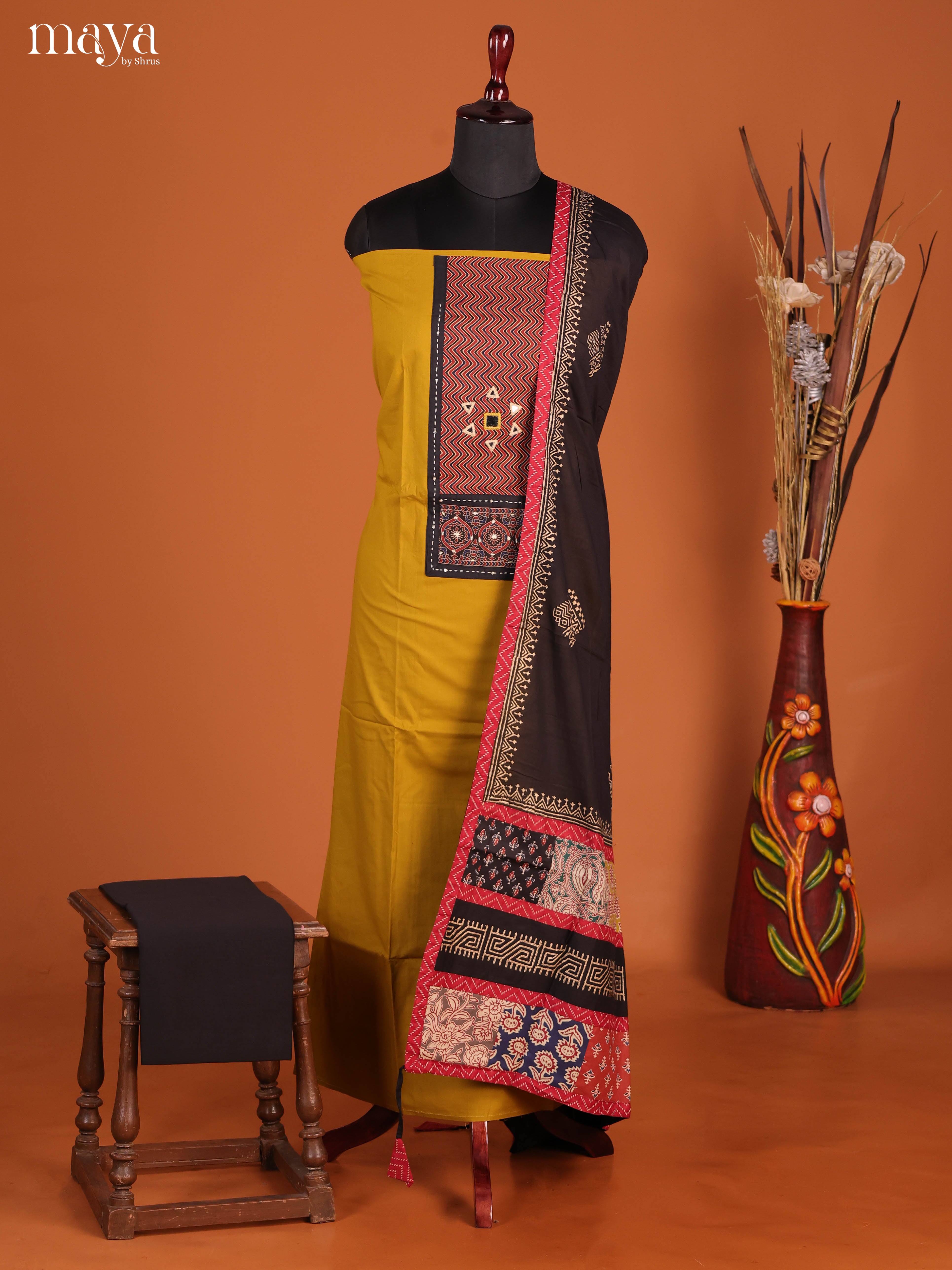 Vibrant Mustard Ajrakh Cotton Dress Material With Black Dupatta