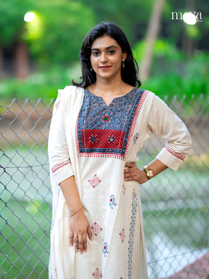 Charming Off white salwar suit With Printed Yoke Neck