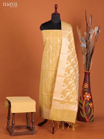 Cute Pastel Yellow Semi Tussar Salwar Suit Material With Thread Woven Design