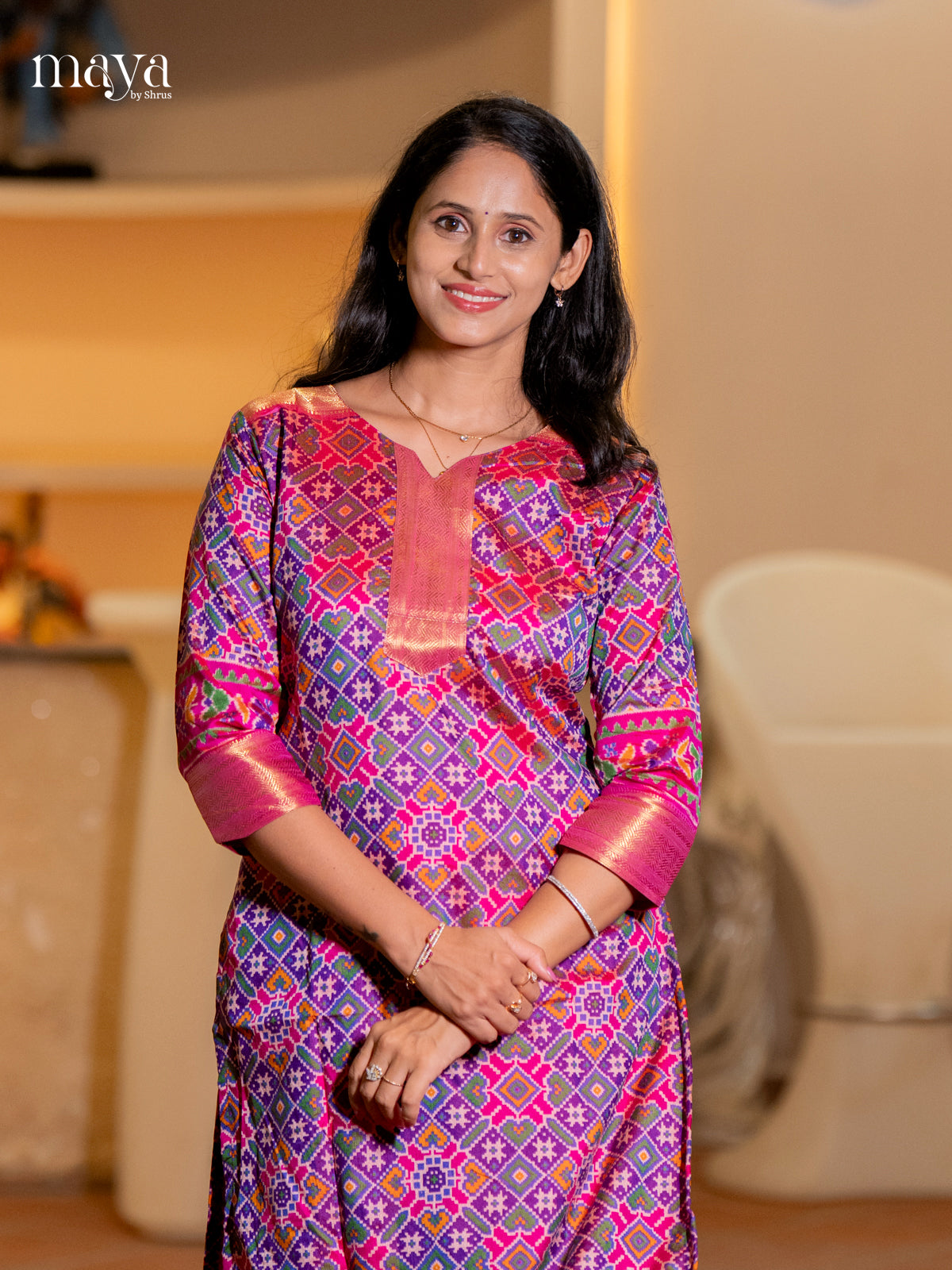 Gorgeous Purple Patola Print Kurti with Silk Zari Border