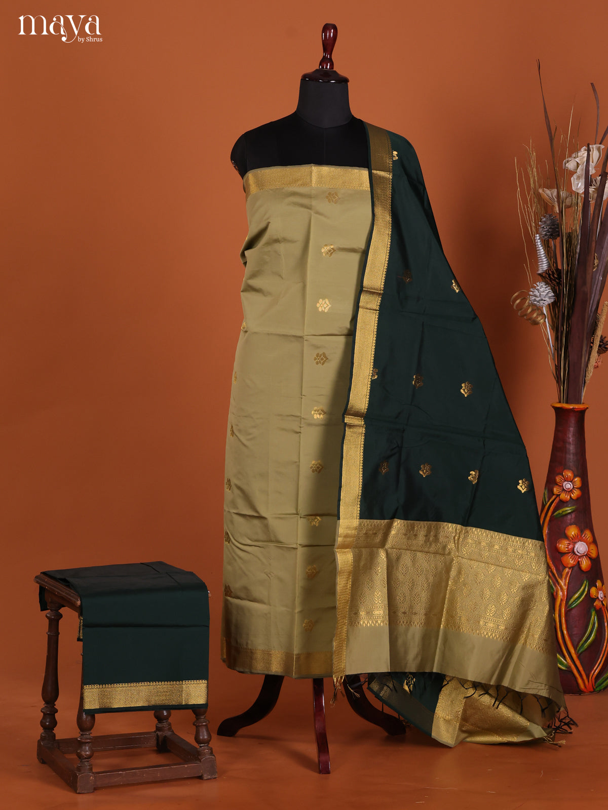 Graceful Grey Semi Soft Silk Salwar Suit With Dark Green Dupatta & Zari Border