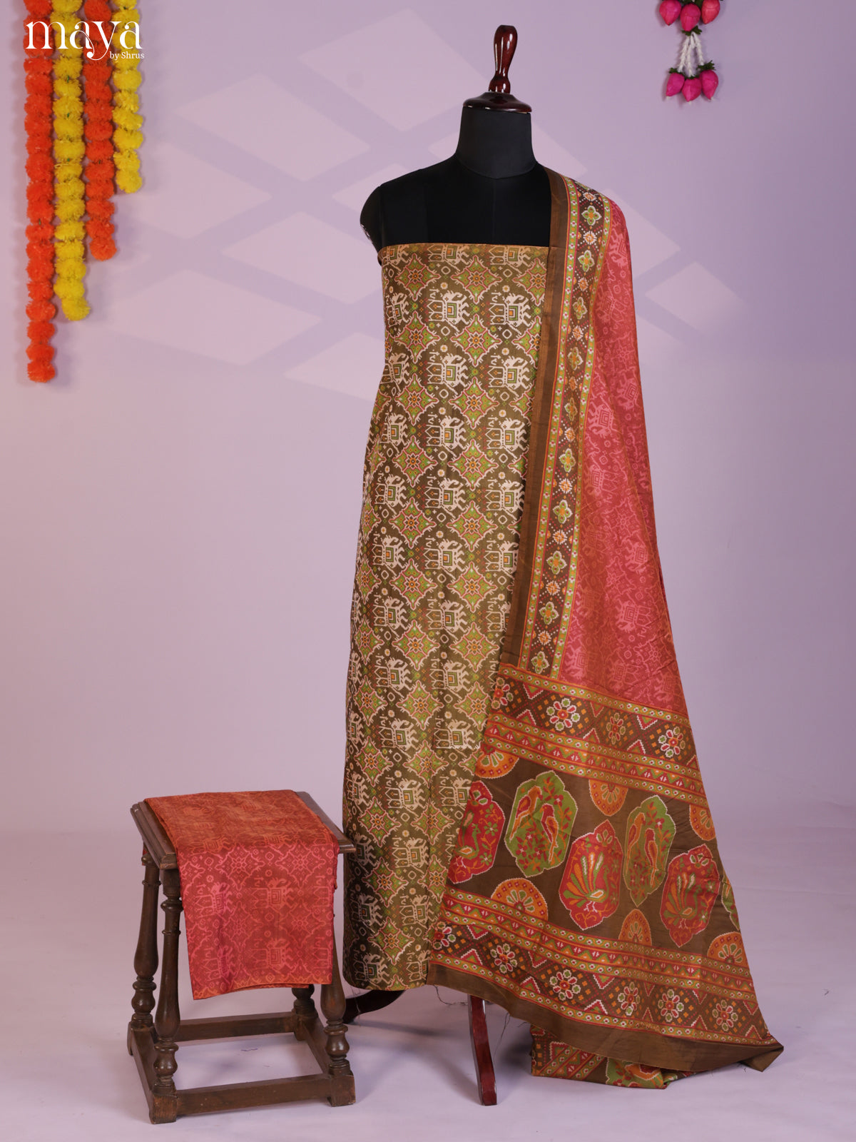 Beautiful Chutney Green & Brick Semi patola salwar unstitch with elephant motifs MEA09036